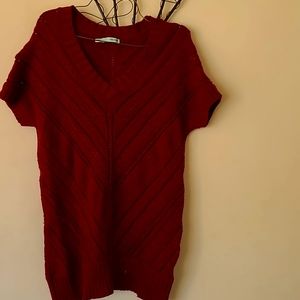 Medium burgundy with a bit of glitter on this shirt/sweater.